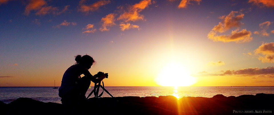 Anna photographing the sunset at Waikiki Beach, Oahu