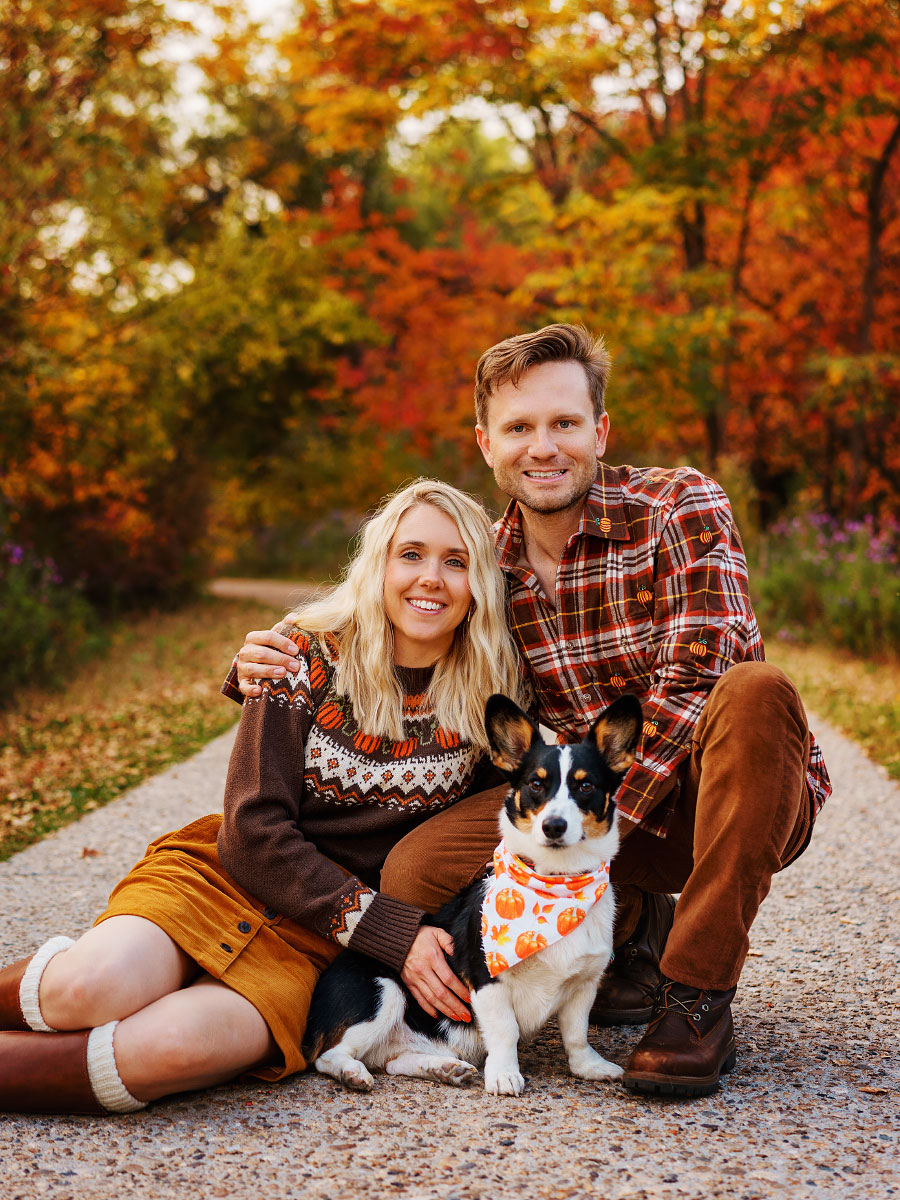 Young couple and their corgi at Kathryn Albertson Park in fall in Boise