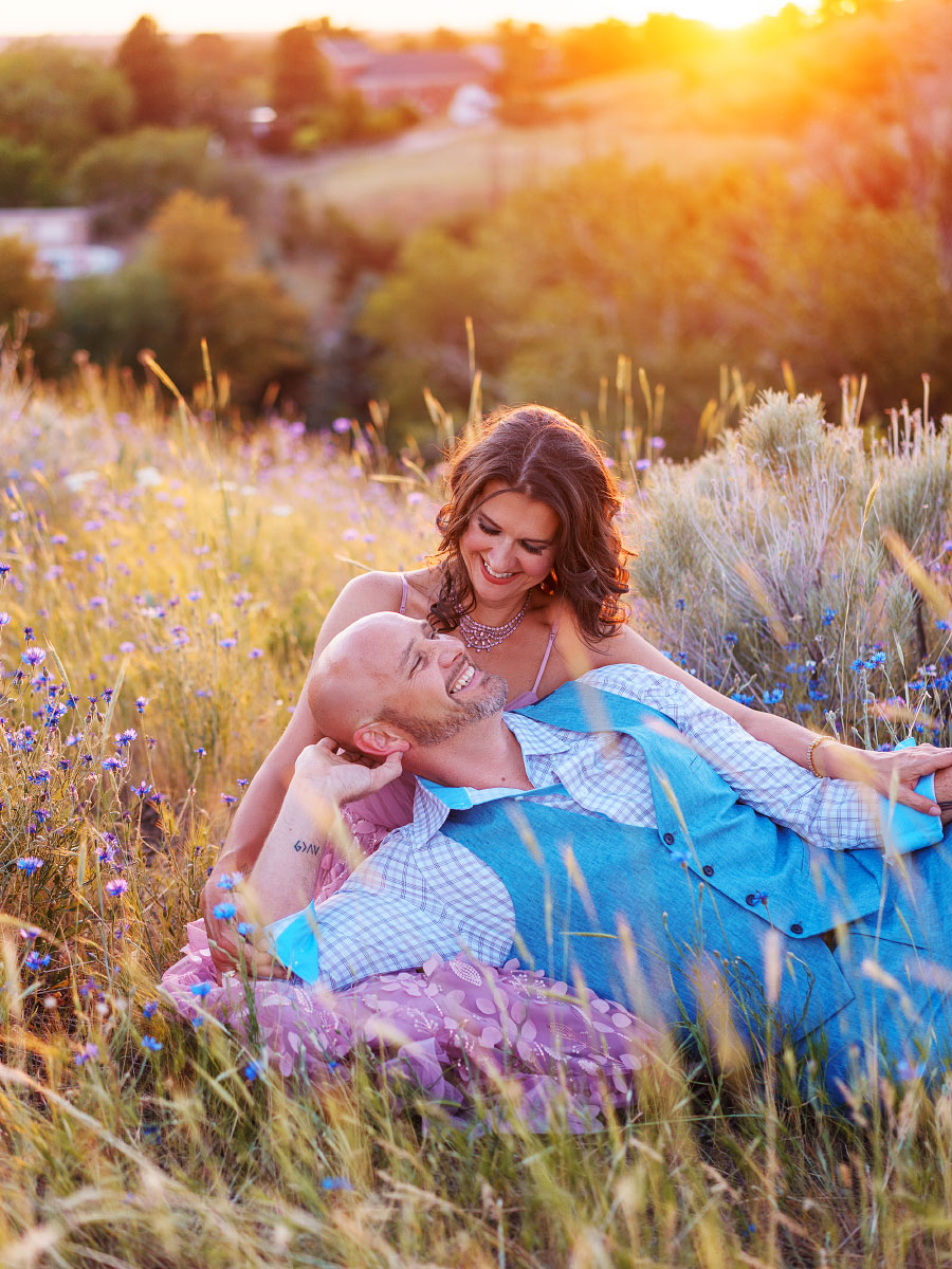 Couple in love in field of wildflowers at Military Reserve Park in springtime in Boise